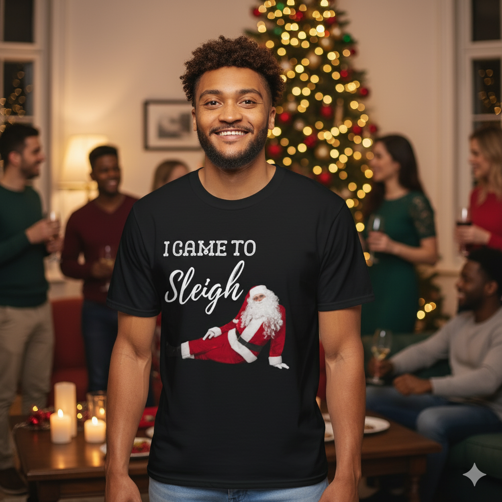 Man wearing a black t-shirt with a Christmas-themed design in a festive indoor setting.