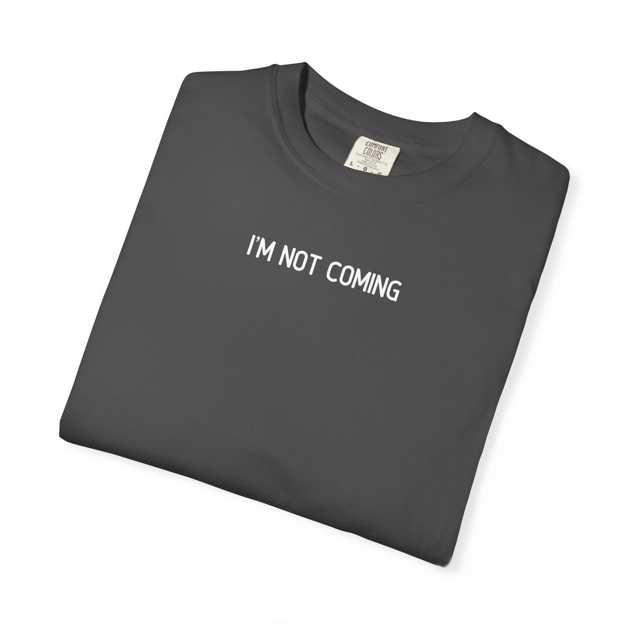 Folded dark graphite t-shirt with 'I'M NOT COMING' text on a white background