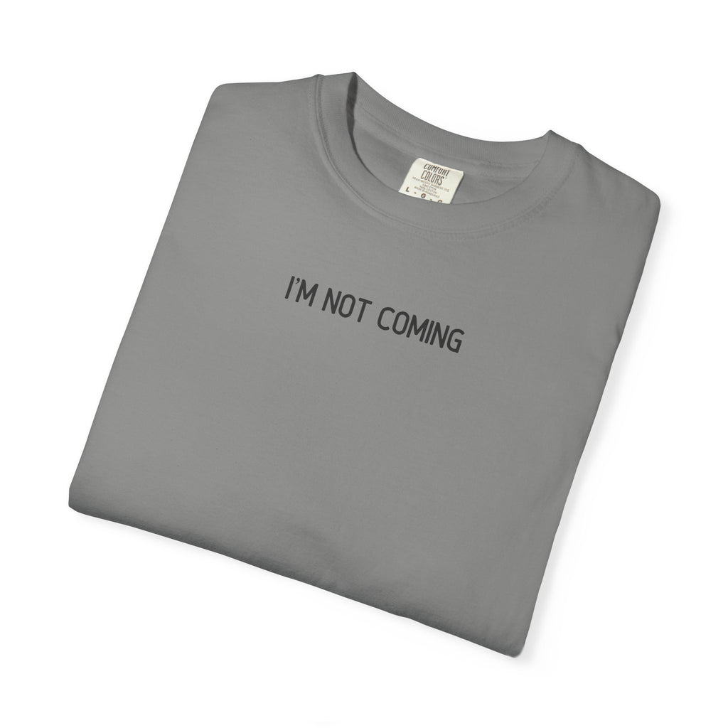Folded gray t-shirt with 'I'M NOT COMING' text on a white background