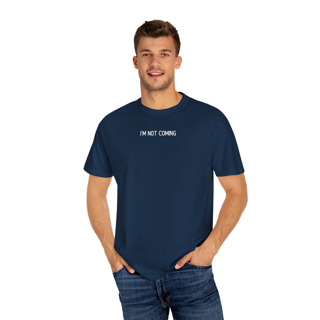 Man wearing a navy blue t-shirt with 'I'M NOT COMING' text on a white background